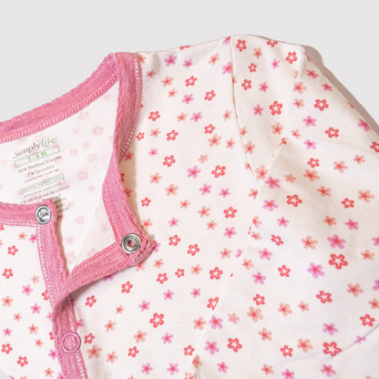 Long sleeved button sleepsuit floral closeup